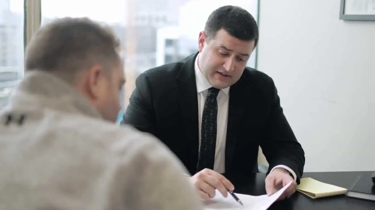A Mike Murphy Law Group lawyer reviewing documents with a client