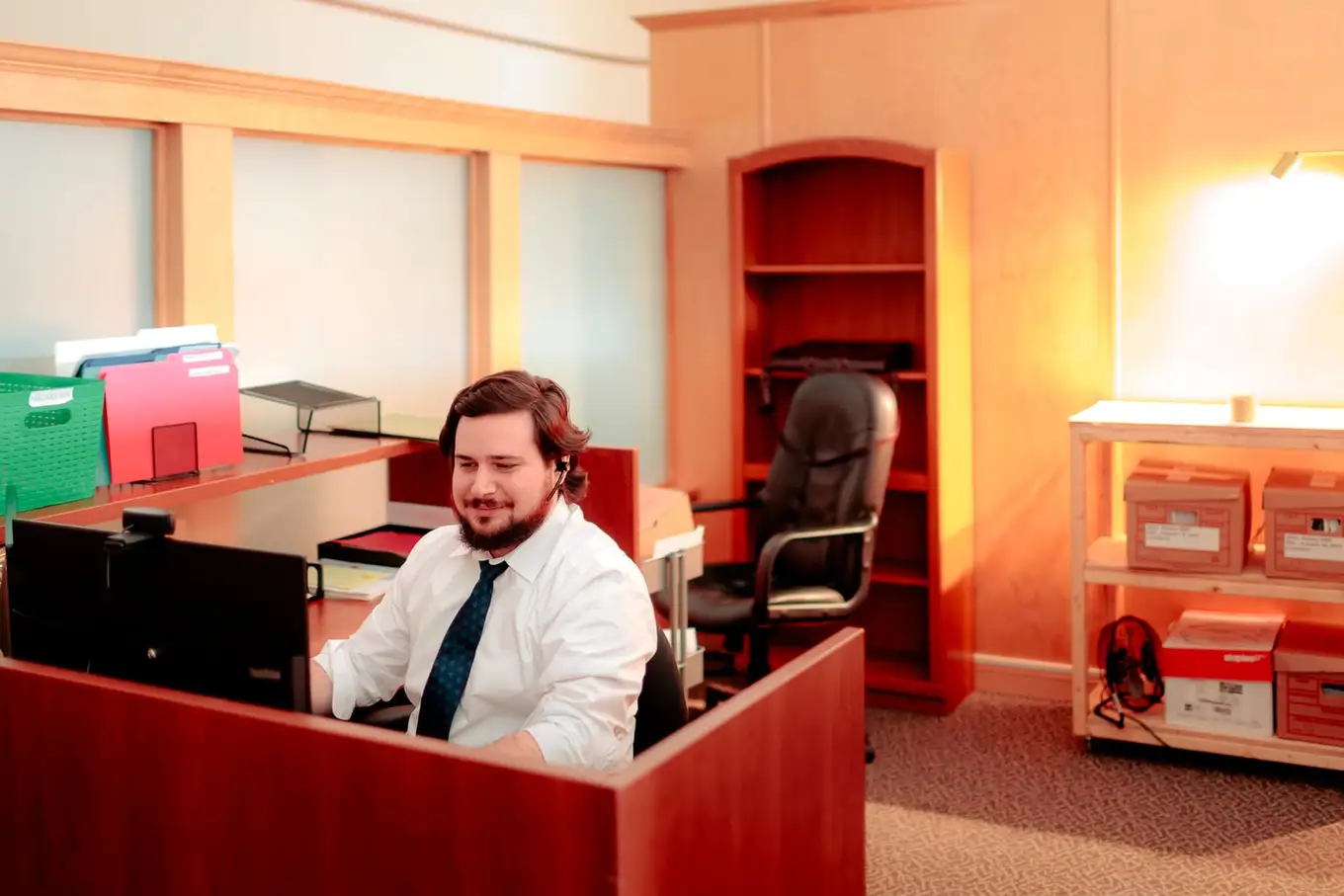 A member of the firm's Moncton team taking a call at the intake desk
