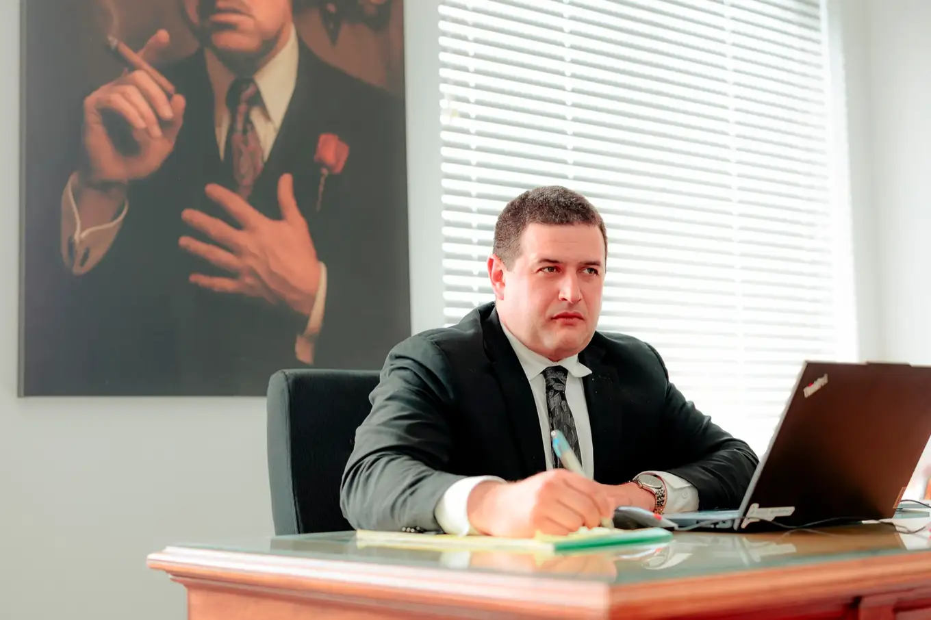 Taylor Morin working at his desk in the Moncton office
