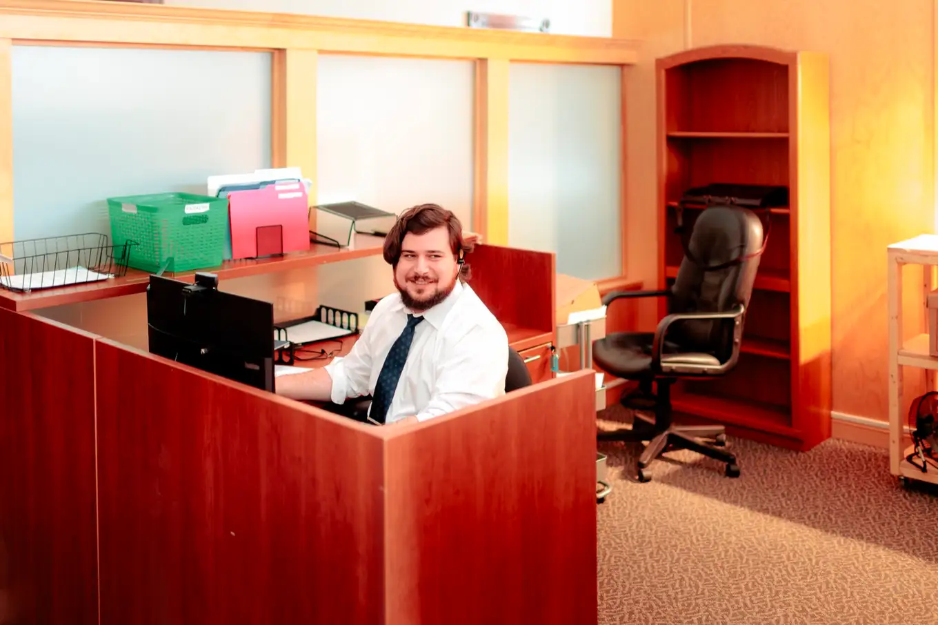 Westin Hebert at the intake desk in the Moncton office